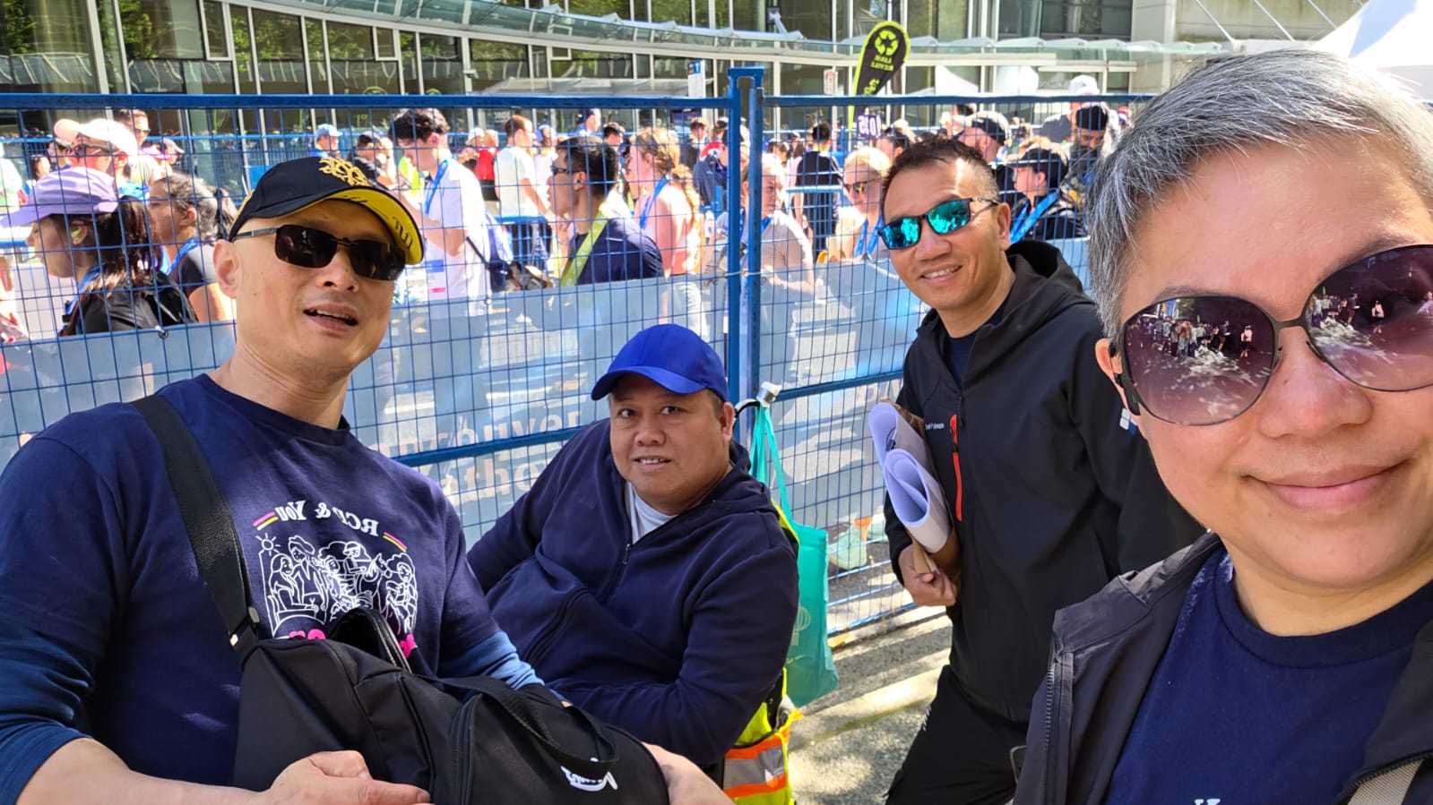Four people together after an event looking happy.